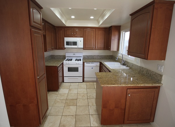 Super upgraded kitchen with new cherry wood cabinets, granite counters, Travertine floor and ne LED lighting